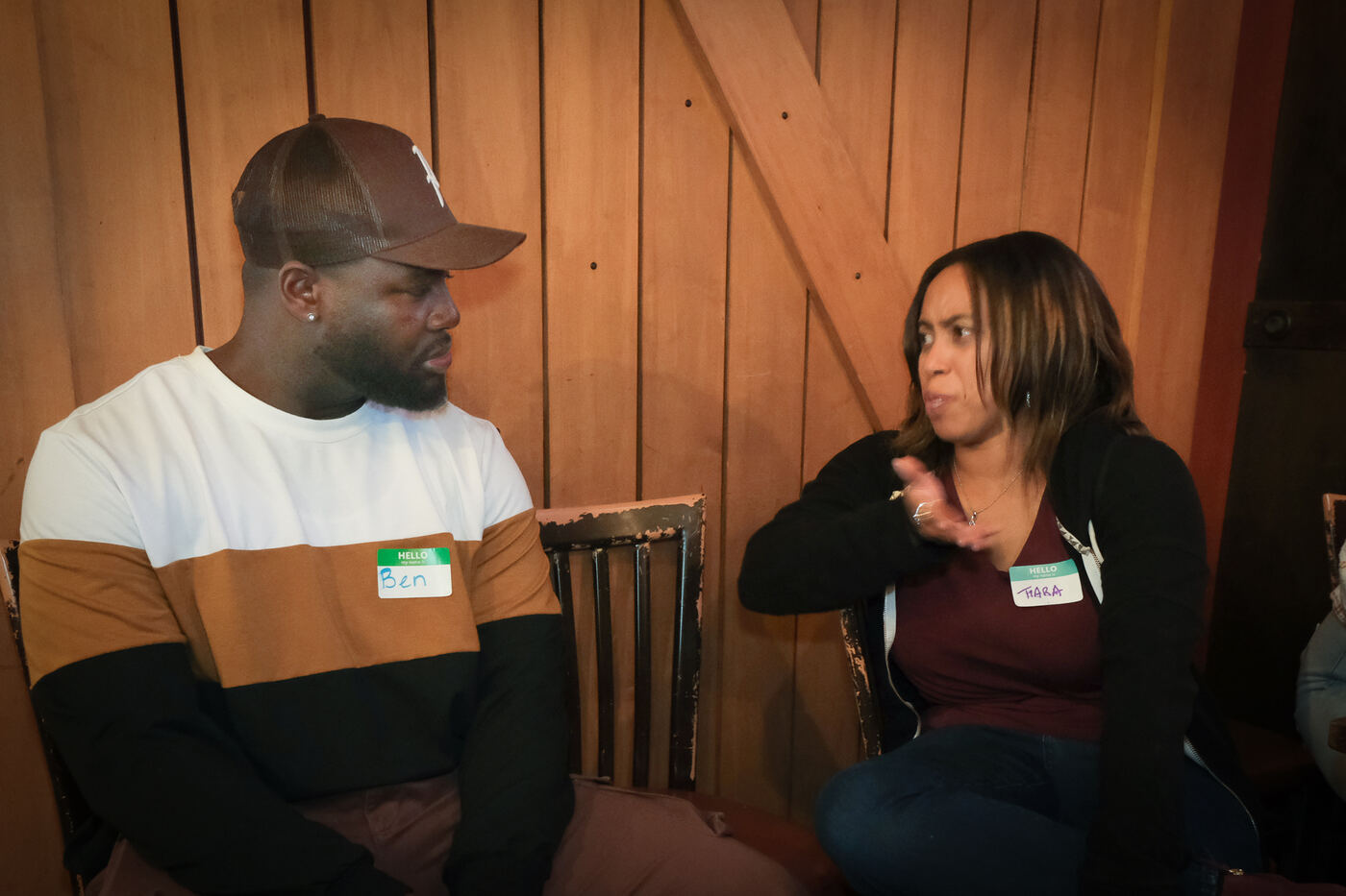 Ben and Tiara deep in conversation at a mixer