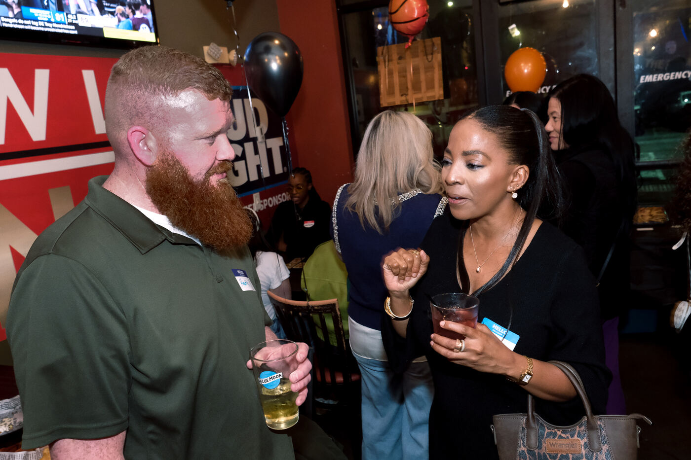 Guests connecting over drinks at a watch party