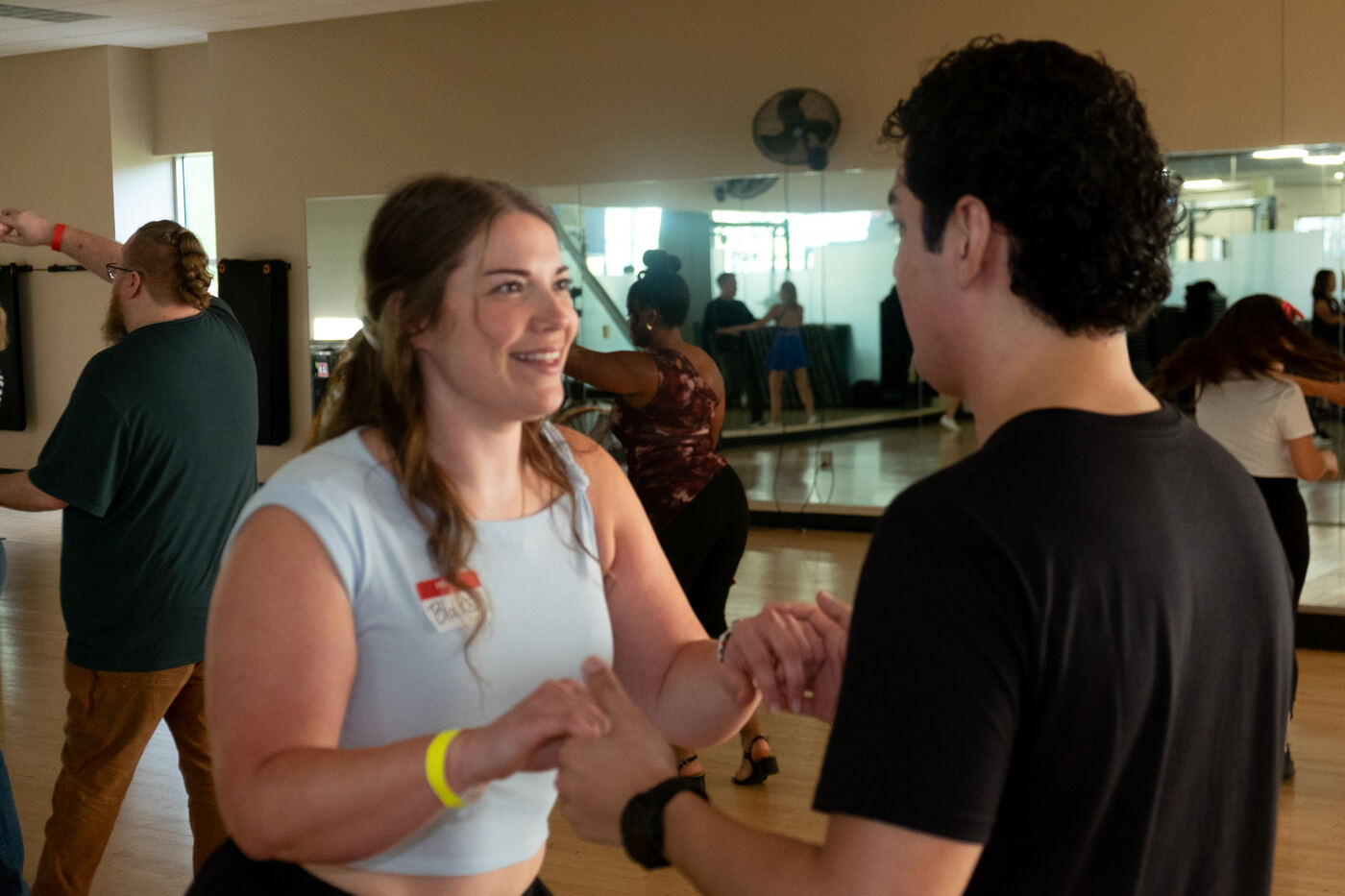 Blake dancing with a partner during a Social Spark lesson